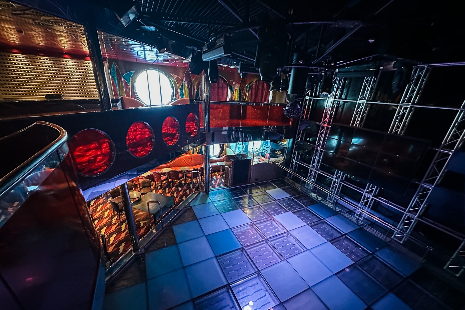 A two-story cruise-ship nightclub with a hell theme