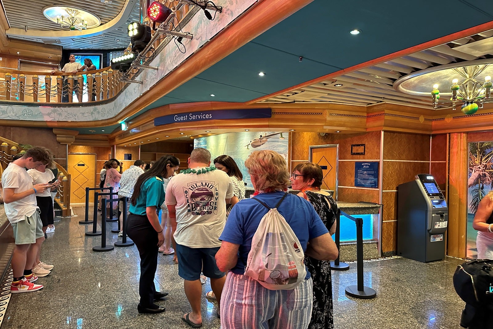 A line at guest services on a cruise ship