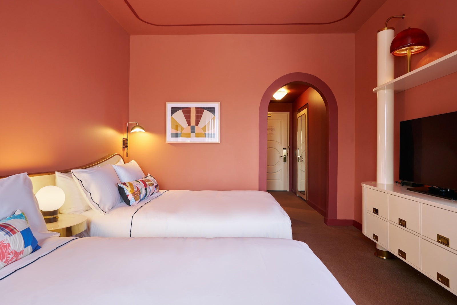 Hotel Genevieve pink room with two beds