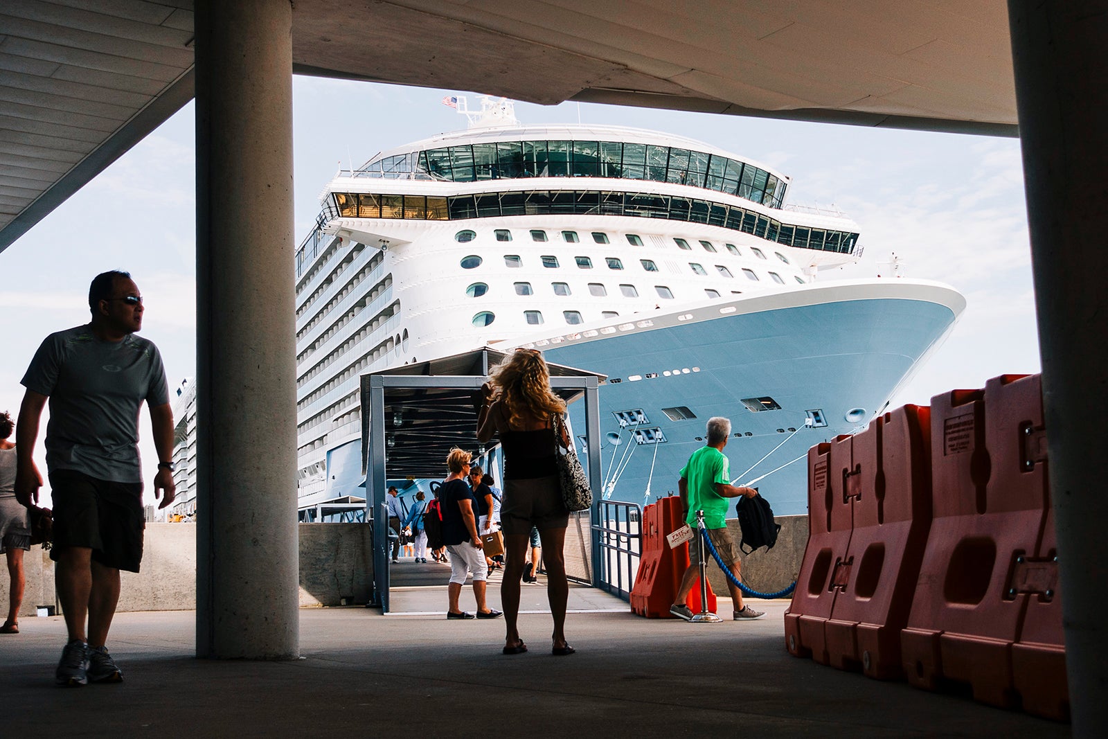 Passengers walk off of cruise ship