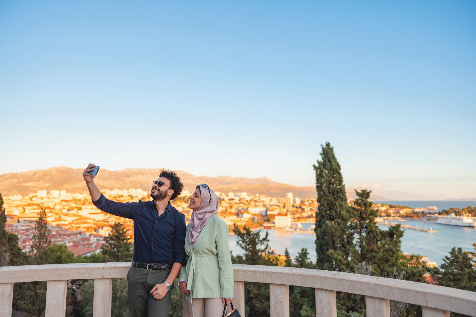 Couple takes selfie by water