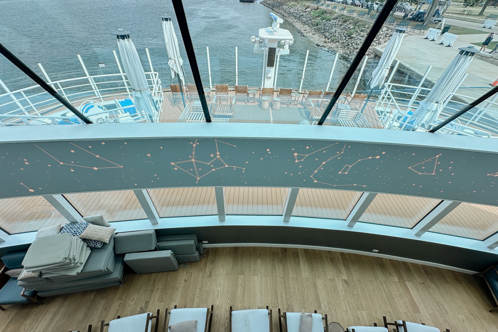 View from the second deck of a lounge on a cruise ship looking out over the bow