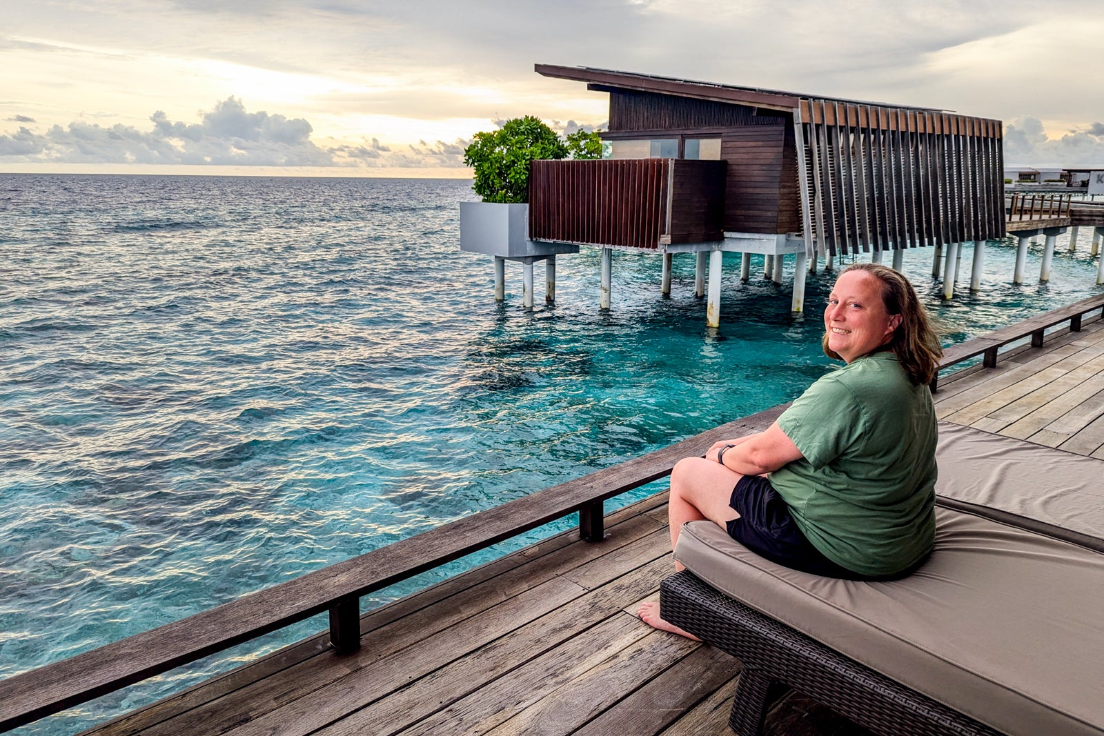 Park Hyatt Maldives with Katie Genter on the deck of an overwater villa