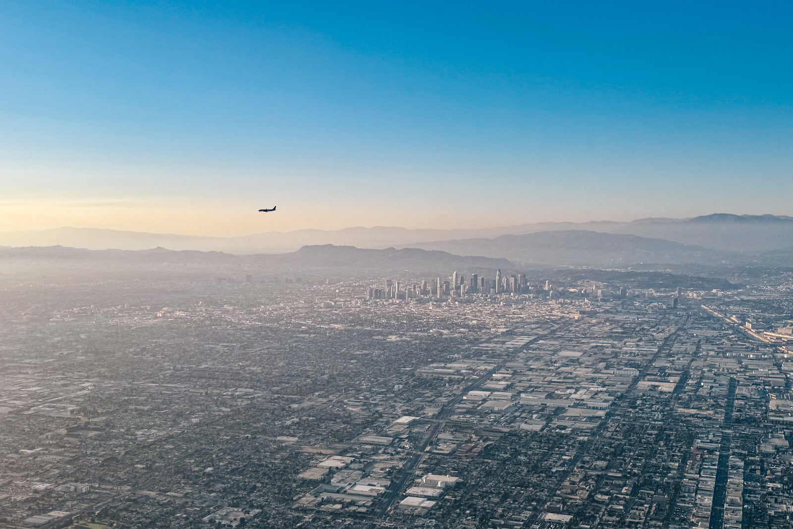 plane over city skyline