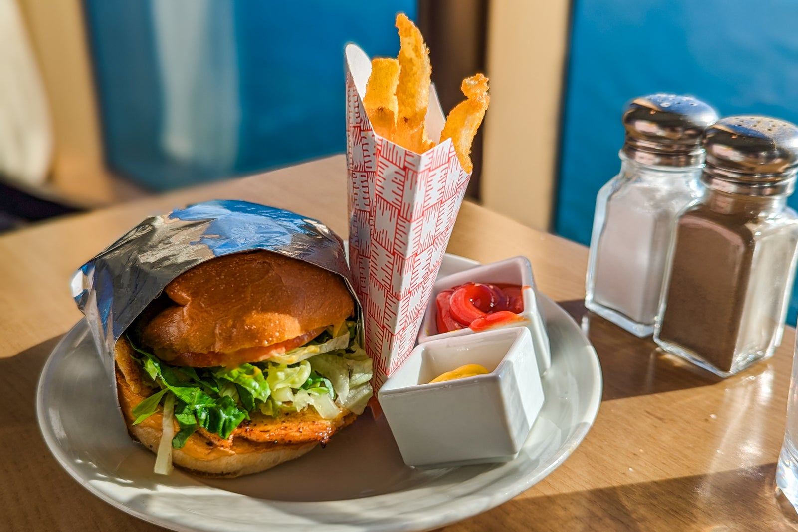 Chicken sandwich with fries and ketchup