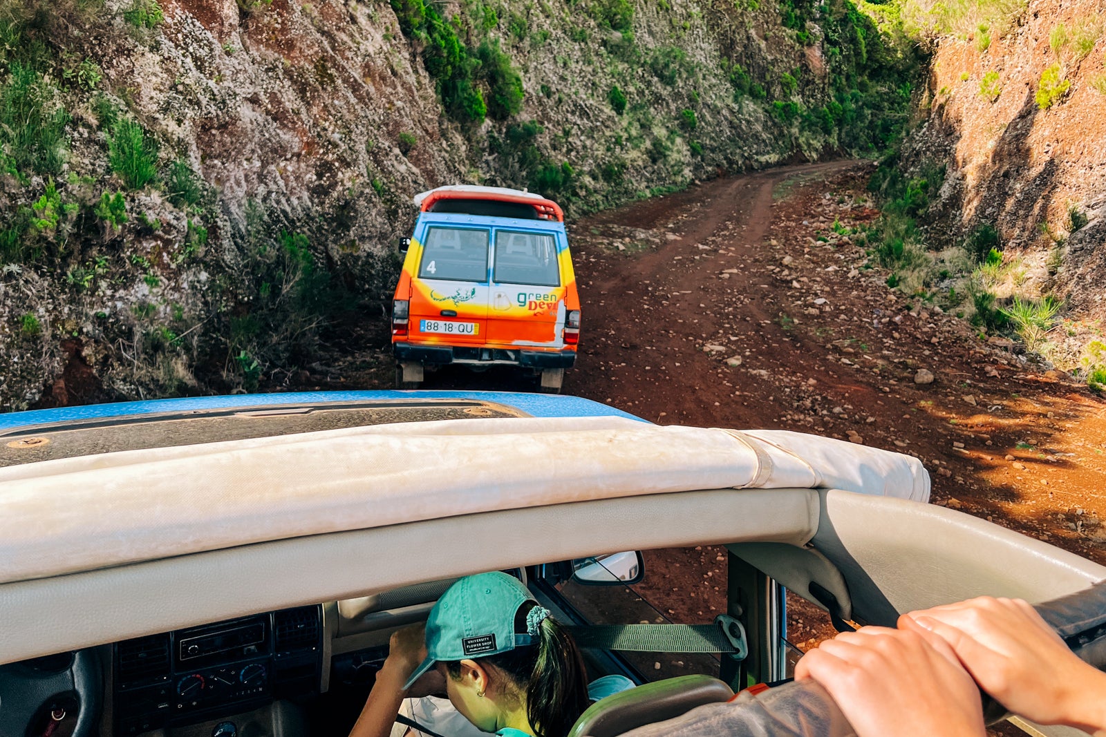 Green Devil Safari vehicles offroading up a mountain in Madeira, Portugal