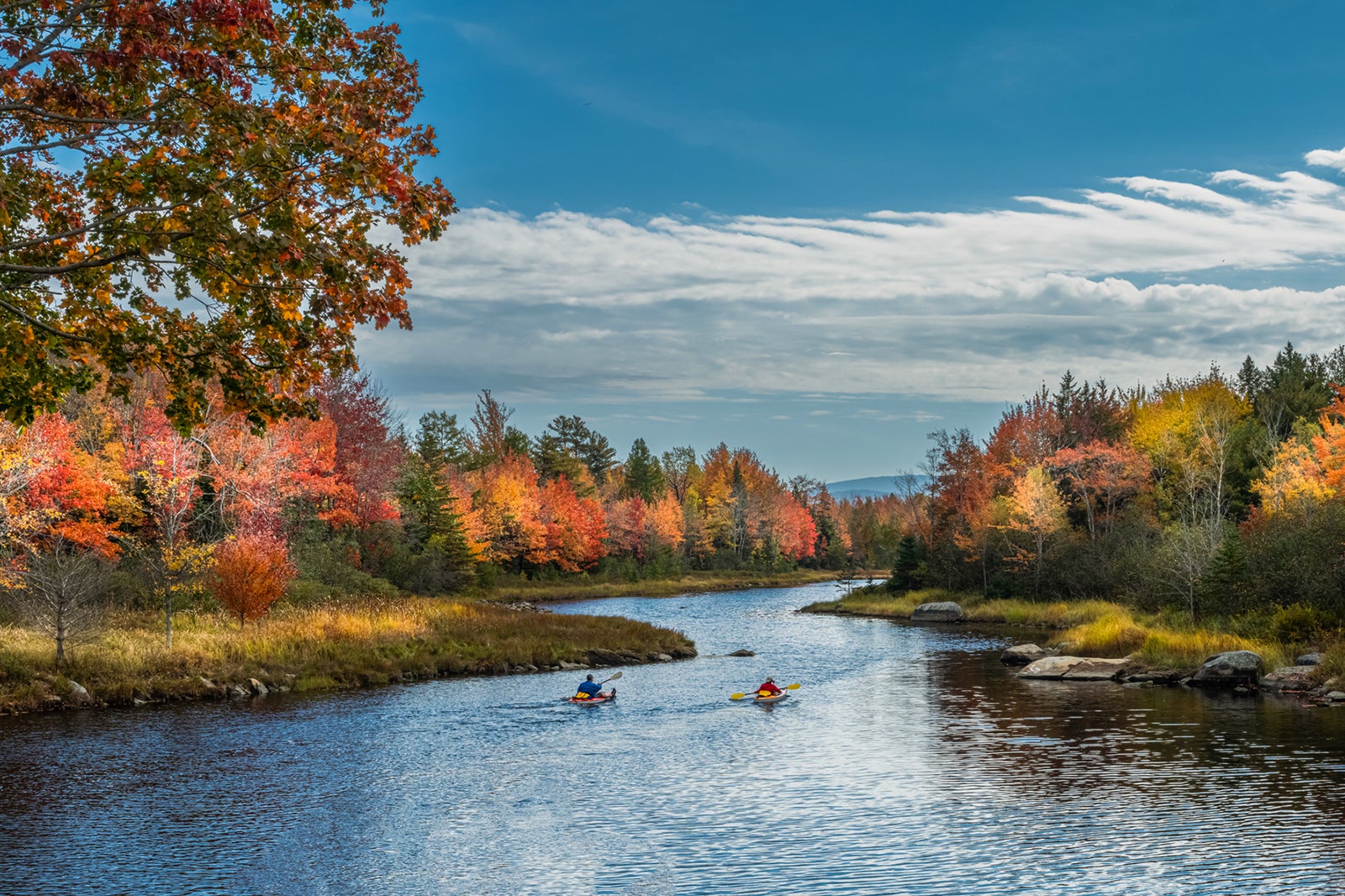 Kayakers along the Bar Harbor Northeast Creek in Acadia during autumn