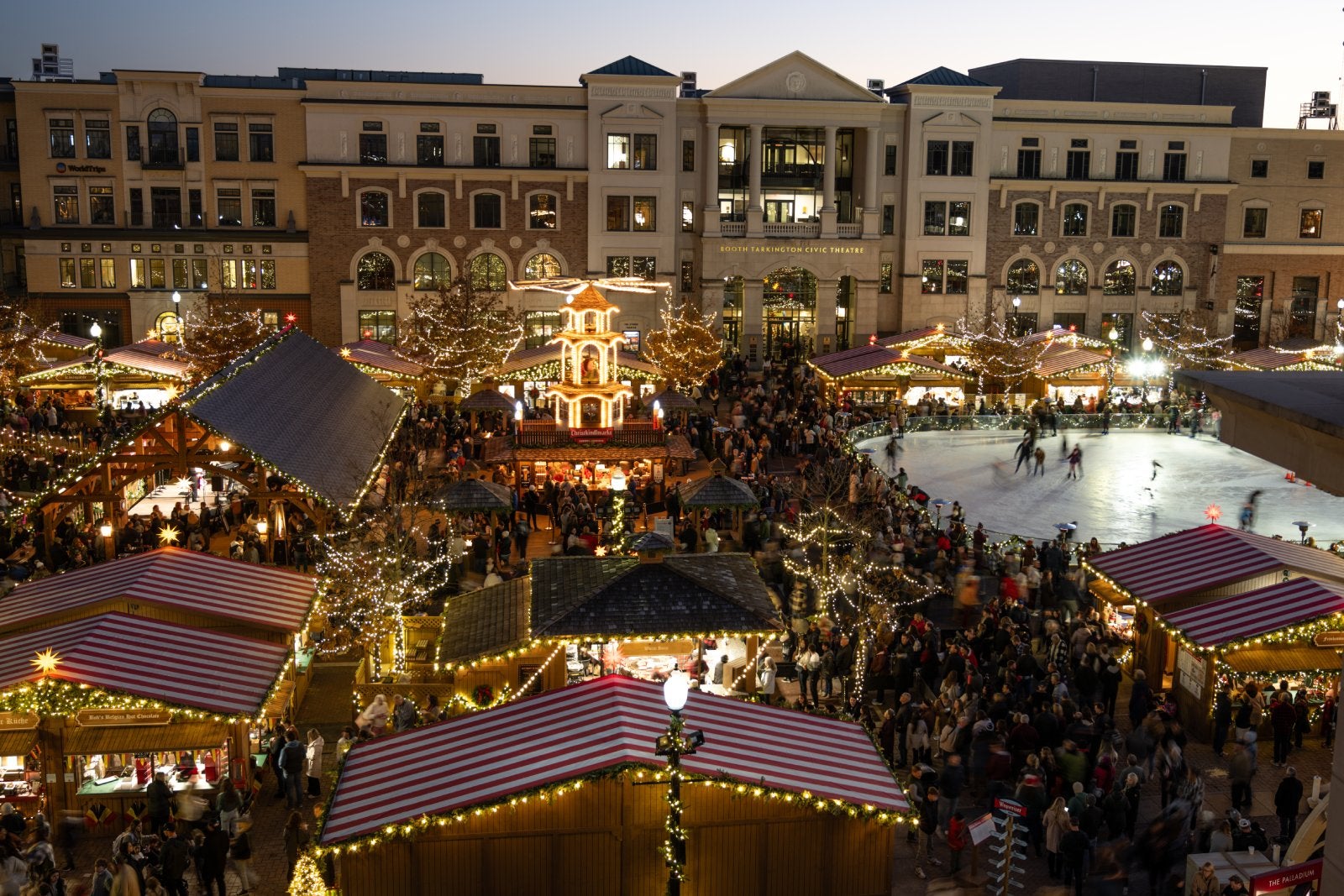 view of a christmas market from above at twilight