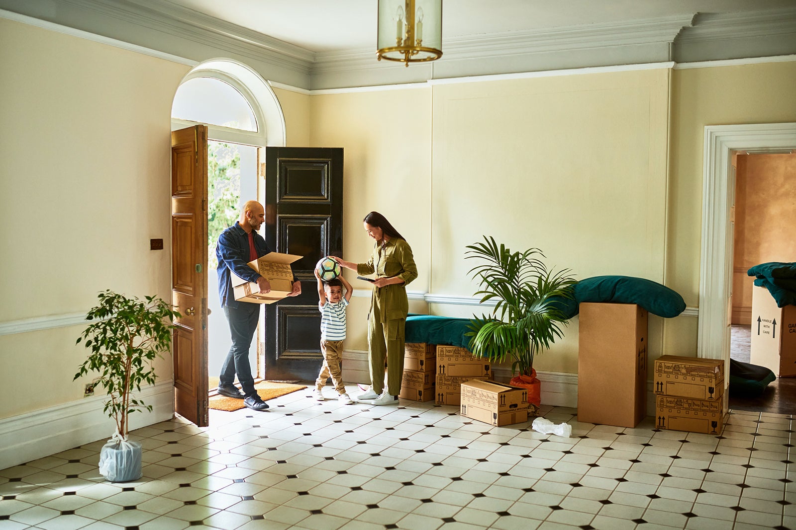 Family in hallway of new house on moving day