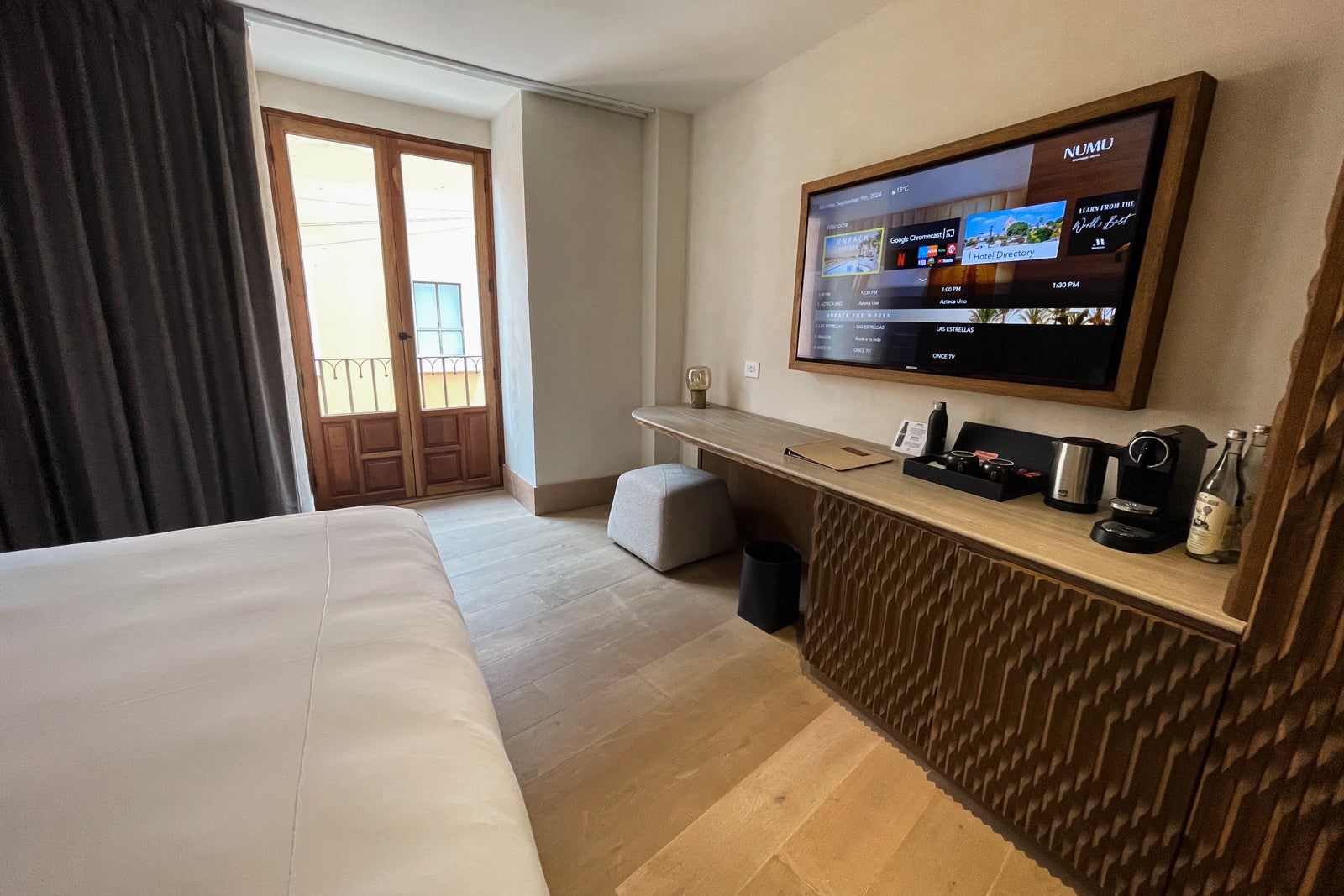 desk, TV, coffee/tea station and French balcony doors in a room at Numu Boutique Hotel San Miguel de Allende, Mexico