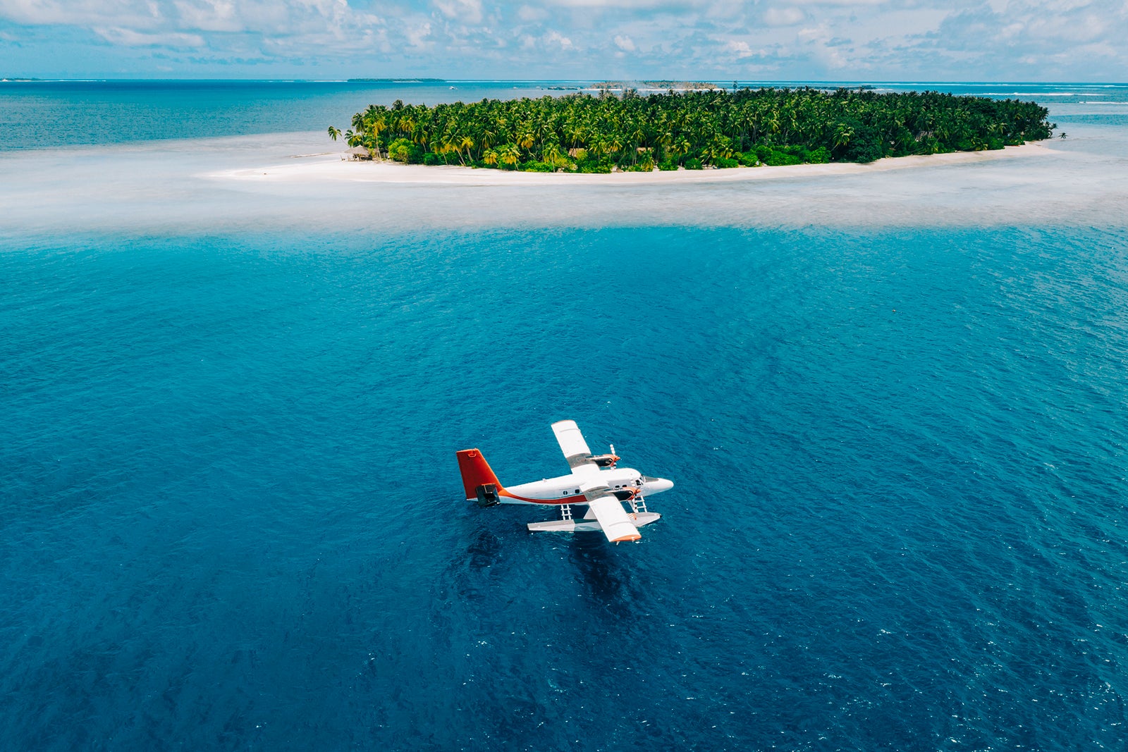 seaplane in Maldives next to island.