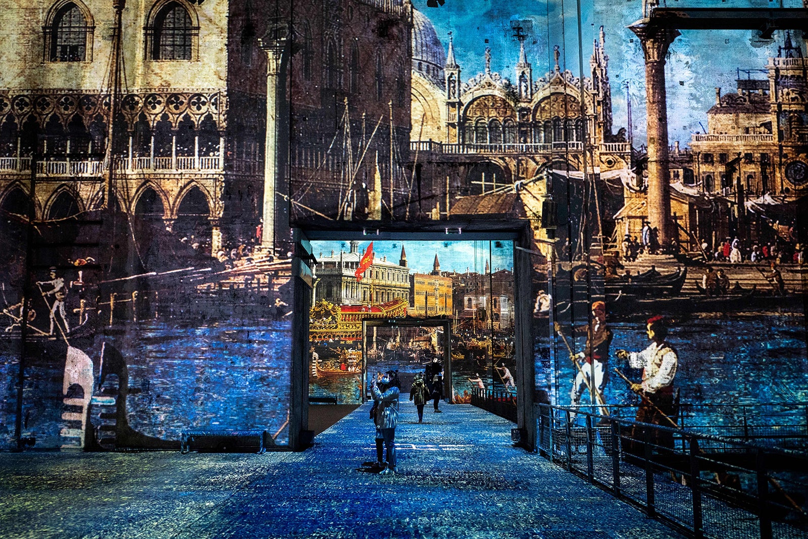 Visitors attend the digital exhibition "Venice, La Serenissima" preview at the Bassin des Lumieres in 2022.