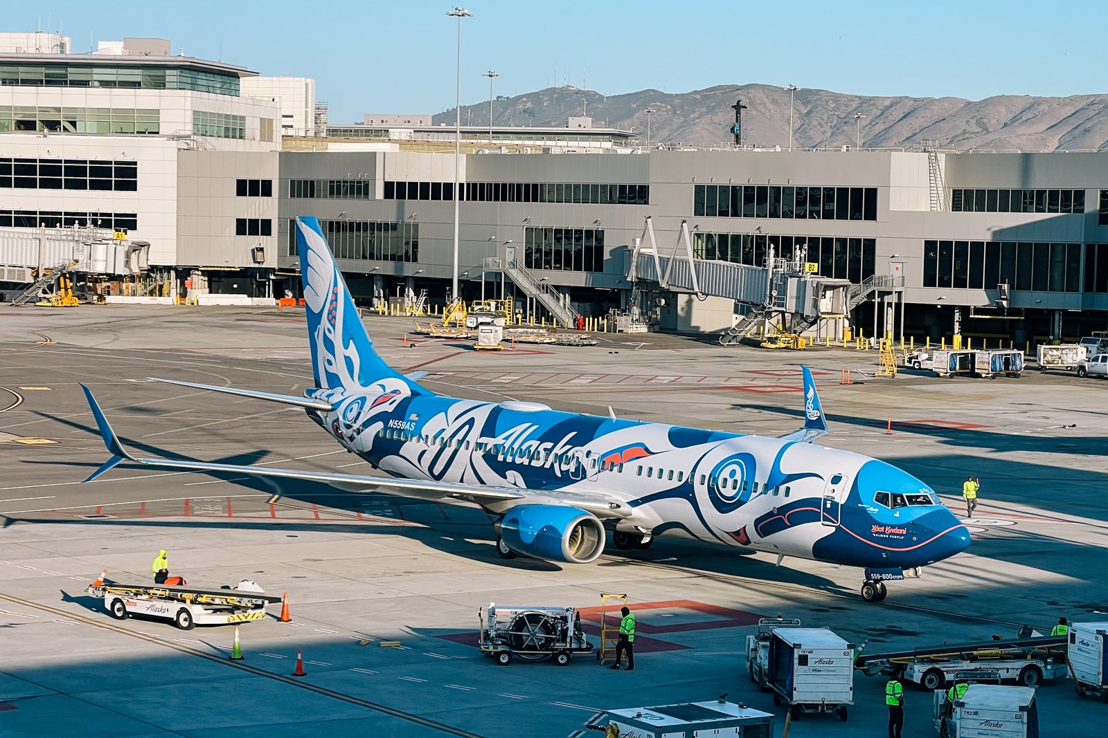 Alaska Airlines Xaat Kwaani (Salmon People) liveried plane at San Francisco International Airport (SFO) in November 2024.