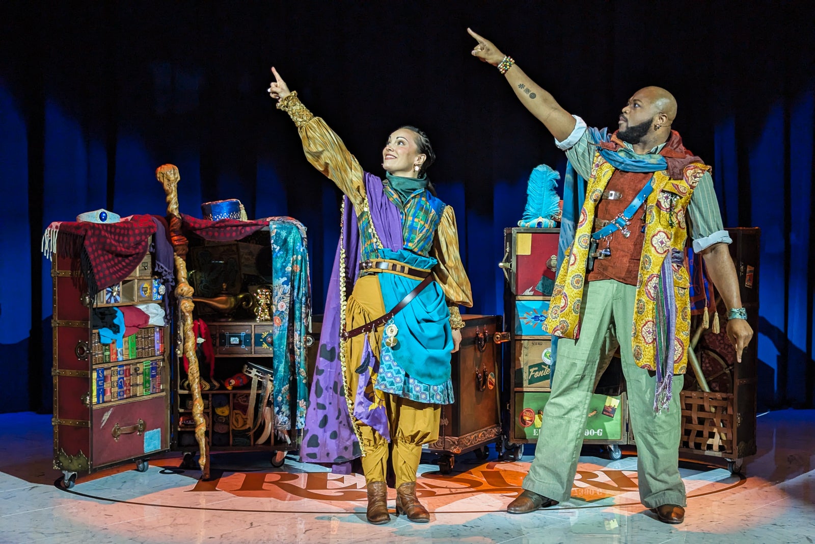 Two actors in front of trunks on Disney cruise ship