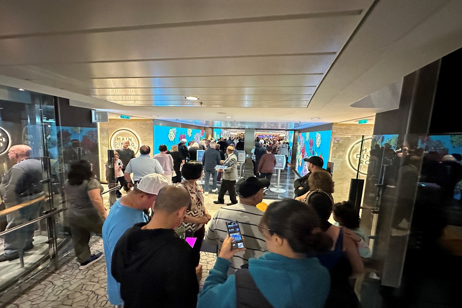 A long line to enter the dining room on a cruise ship