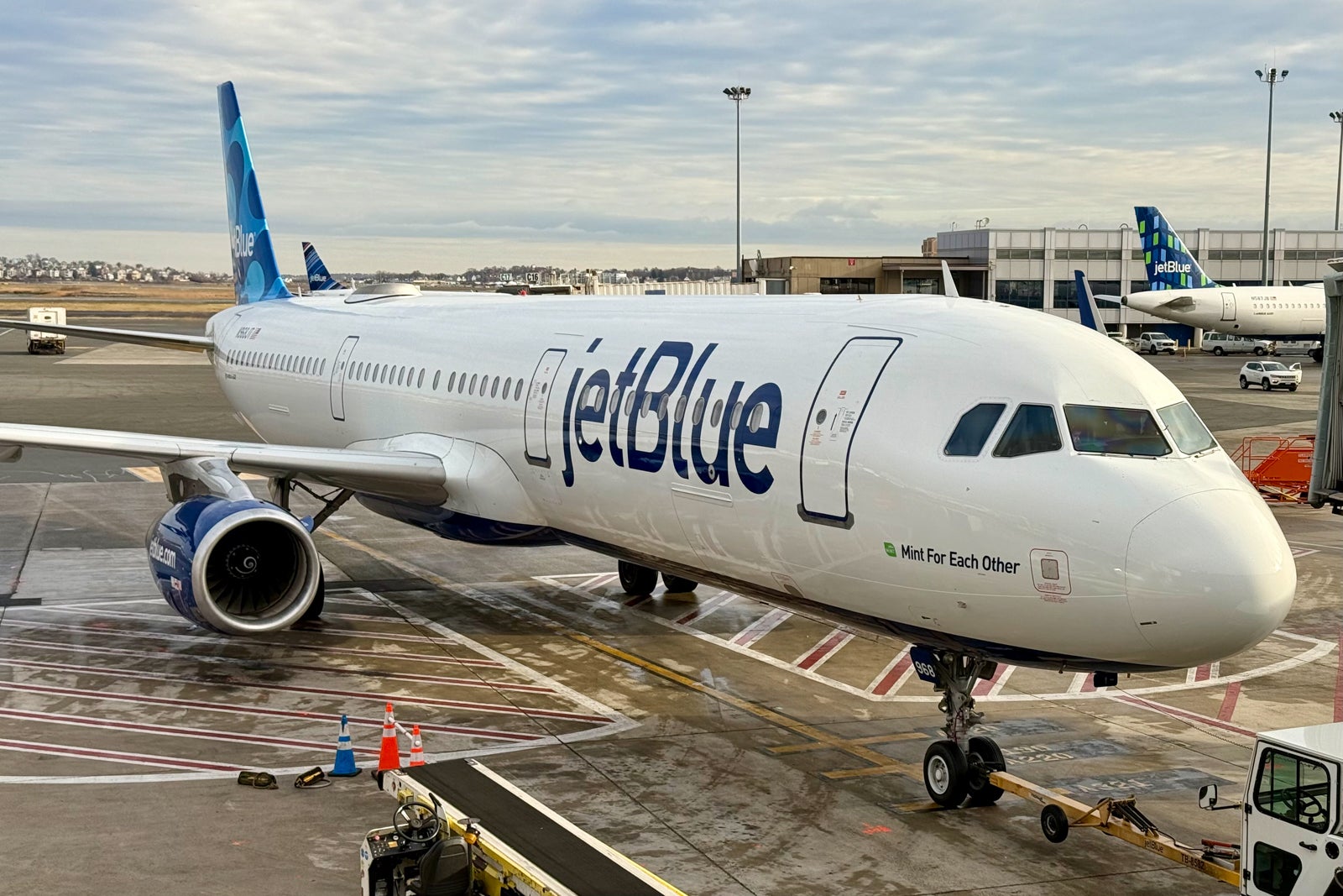 JetBlue plane being towed up to gate