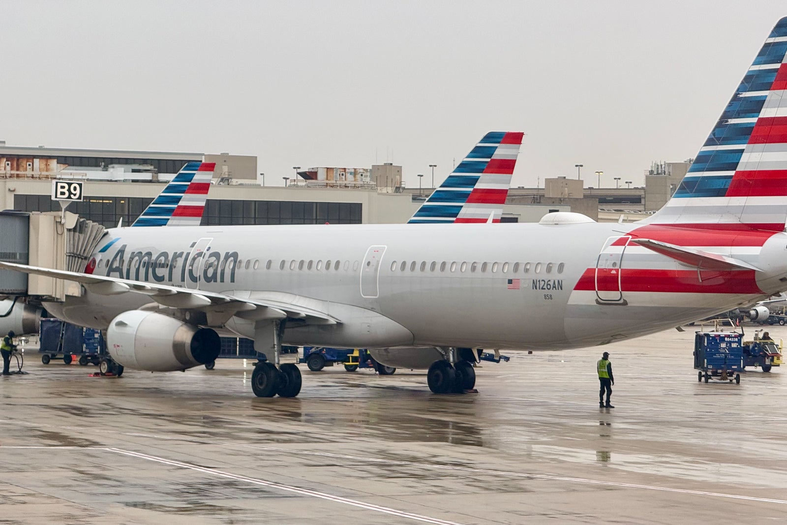 American planes at gate in rain