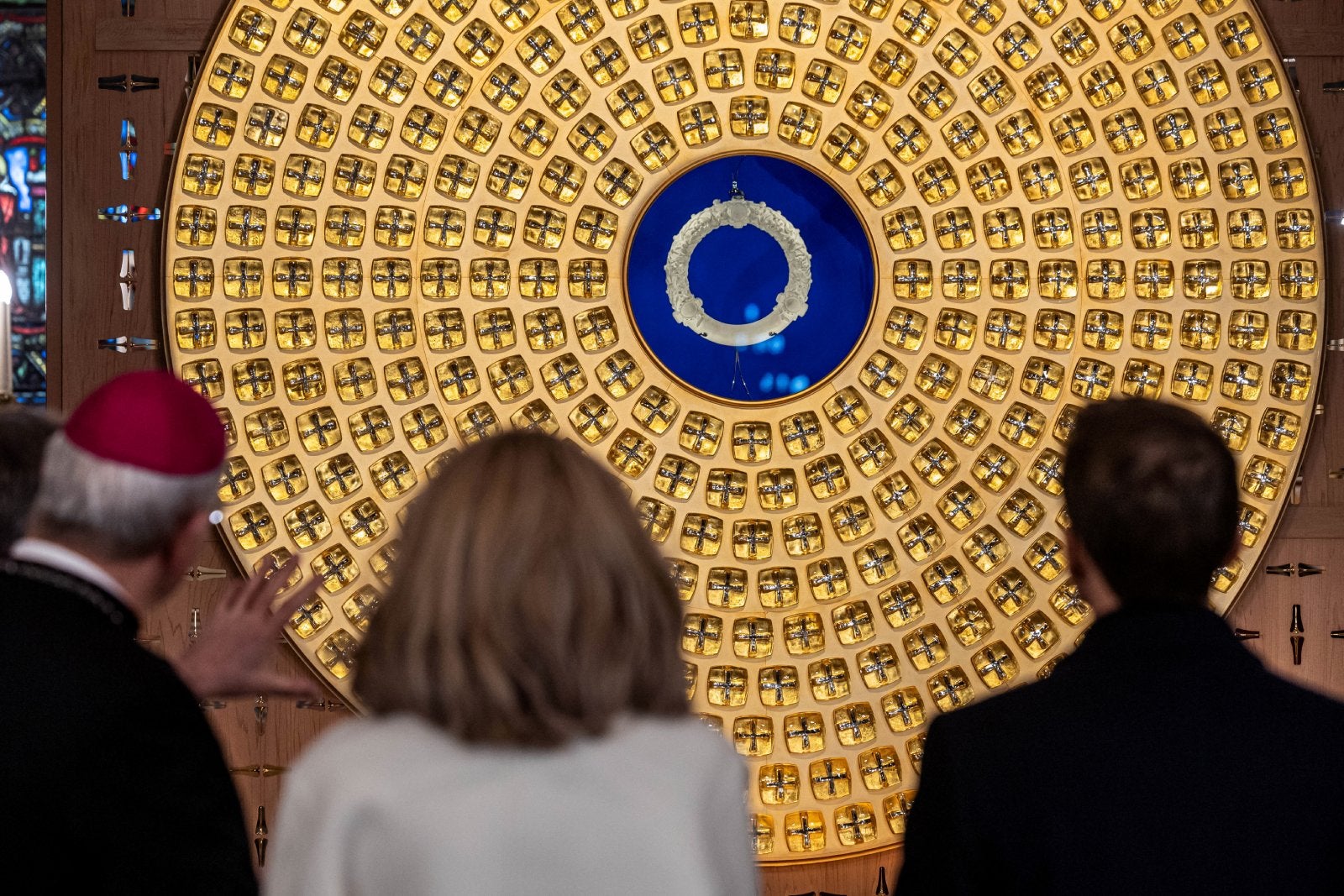 French President Emmanuel Macron and his wife, Brigitte Macron admire the new Crown of Thorns reliquary by Sylvain Dubuisson on a visit before Notre Dame's reopening