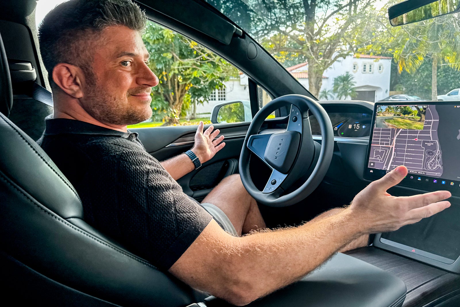 Brian Goldbfarb showing off Tesla self-driving feature. 