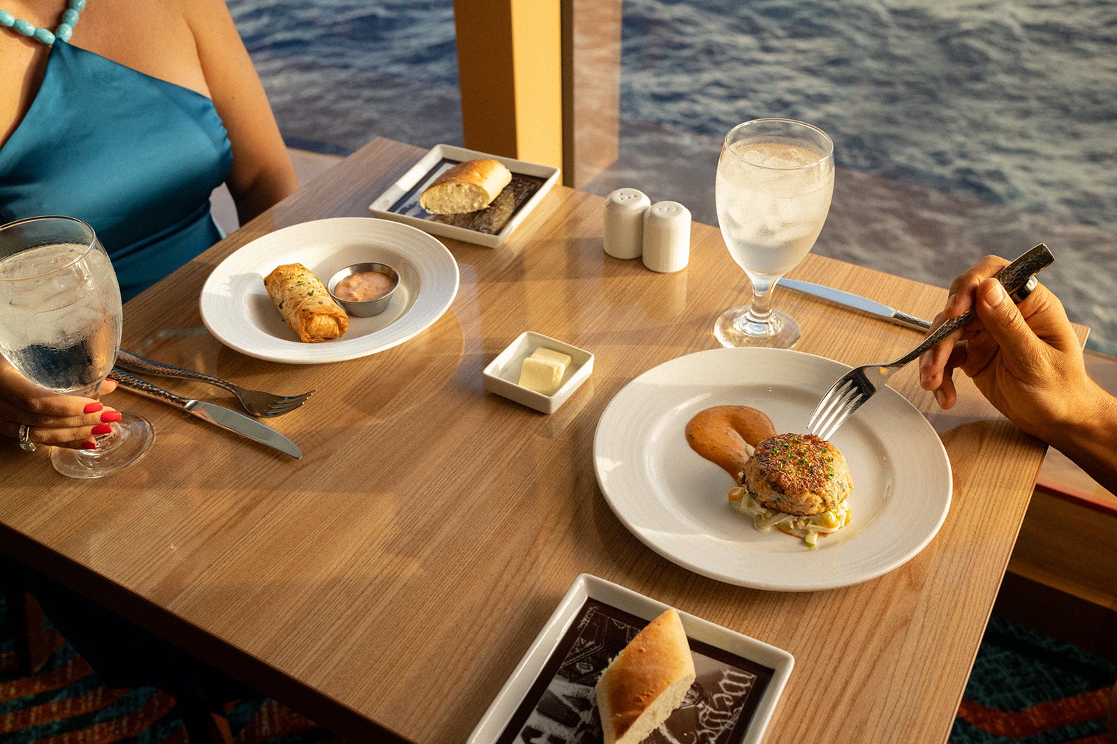 A couple dining on a cruise ship