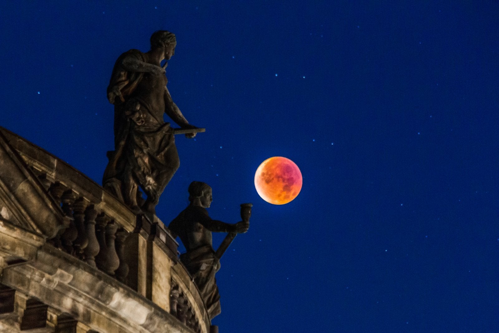 The moon passed through Earth's shadow on Sunday, Sept. 27, in a dazzling total lunar eclipse during a perigee full moon.