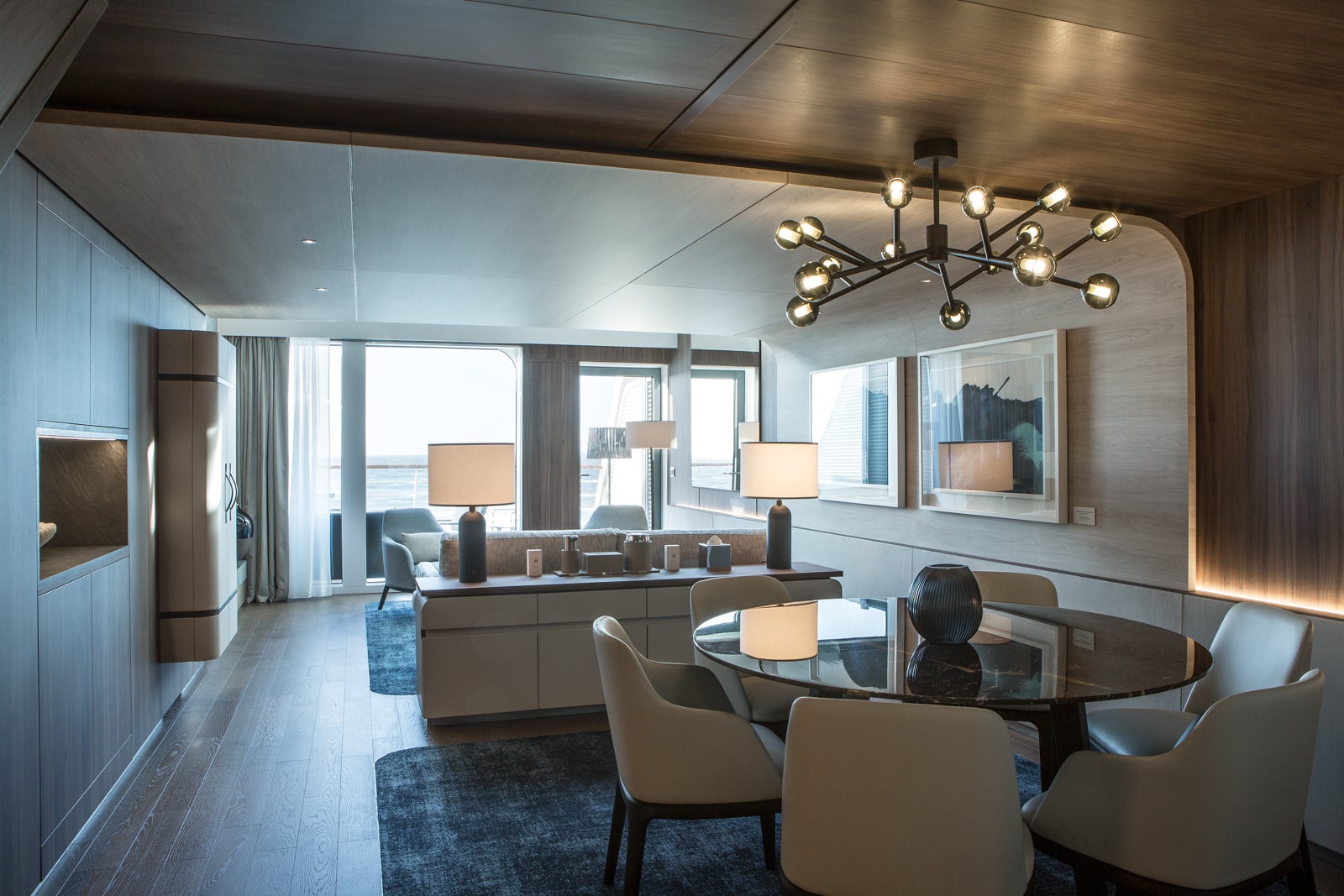 A spacious suite with living room and dining area on Ponant ship