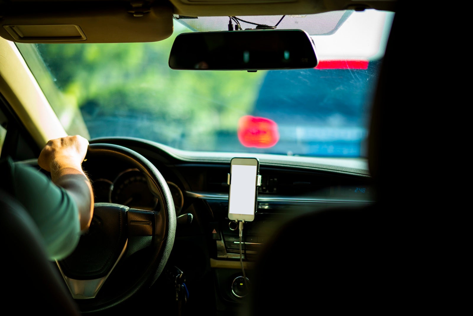 Riding in a car while using a ride-hailing service