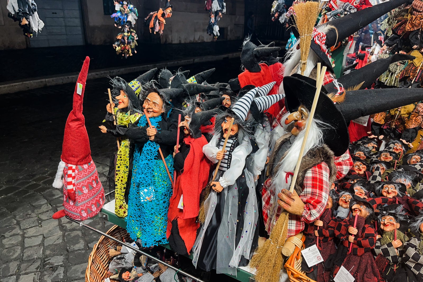 Befana dolls being sold at a holiday market