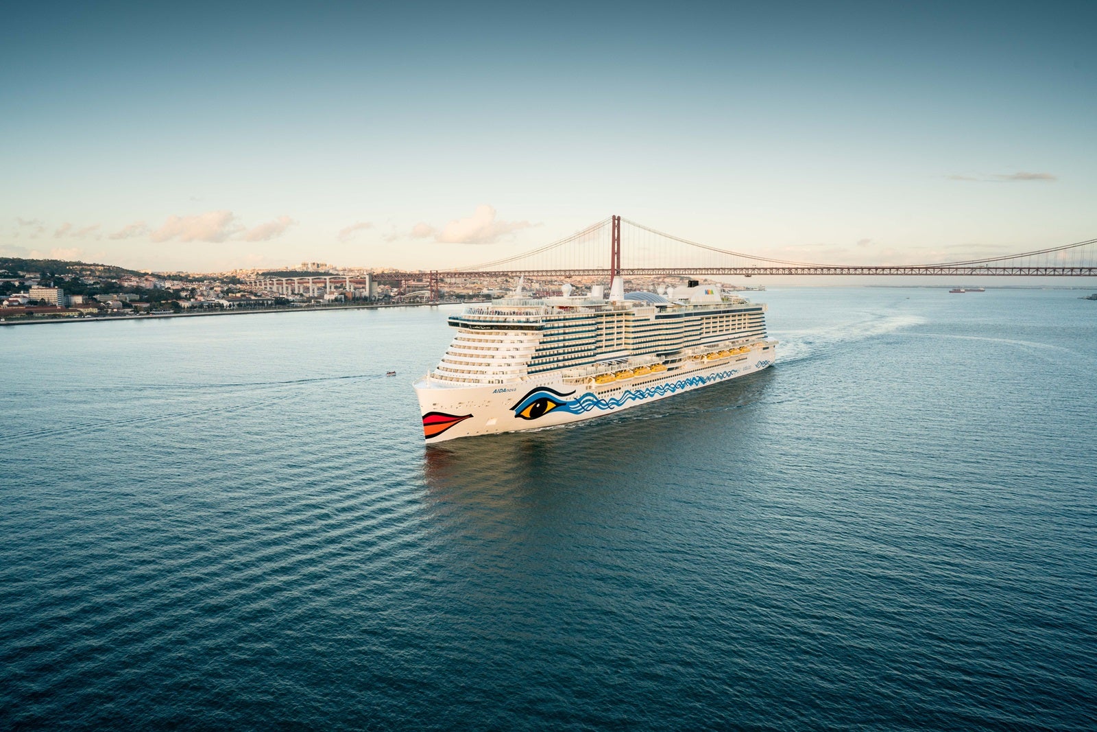 A cruise ship with a hull painted like a face sailing in 