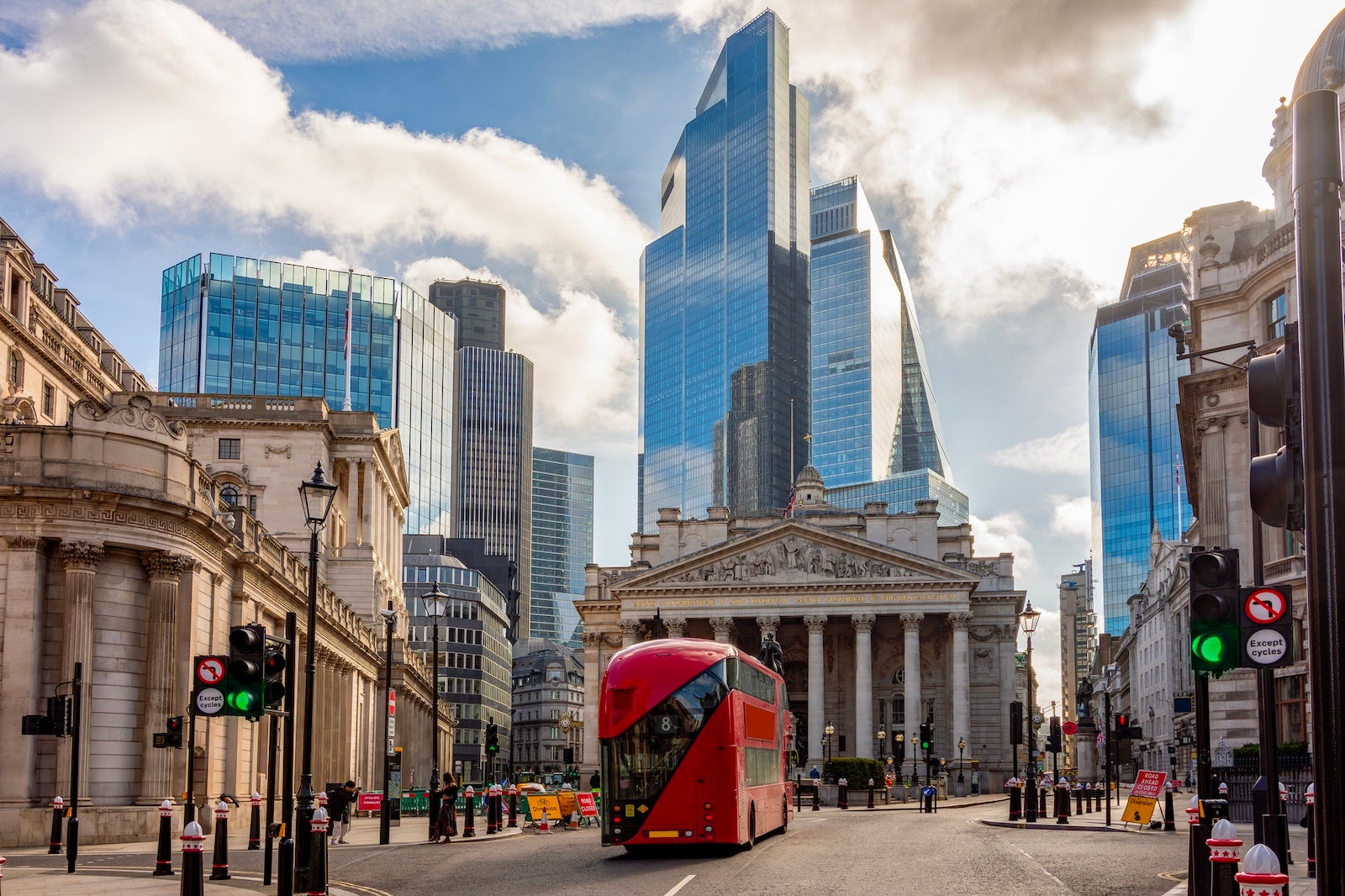 Royal Exchange building and skyscrapers in City of London, UK