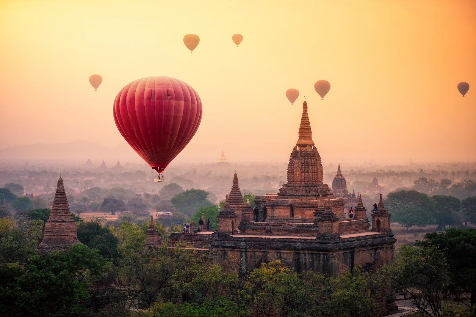 Hot air balloon over plain of Bagan in misty morning, Mandalay, Myanmar