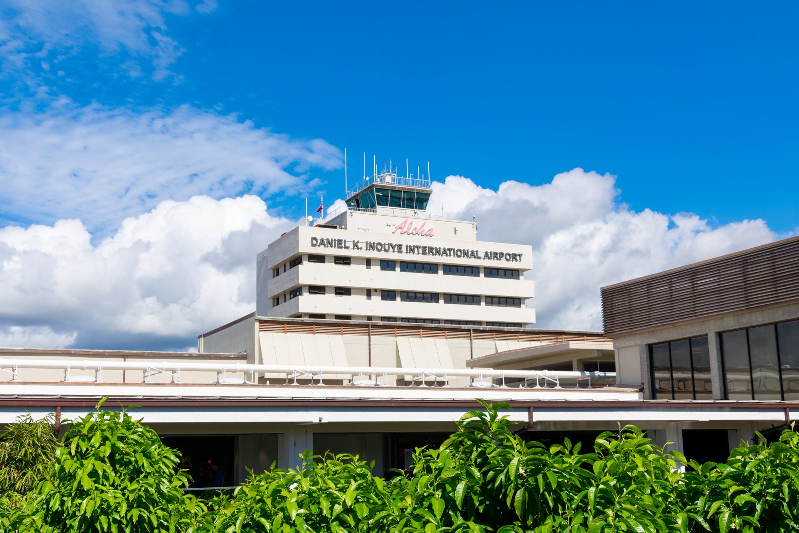 Exterior view of Honolulu's Daniel K. Inouye International Airport with control tower