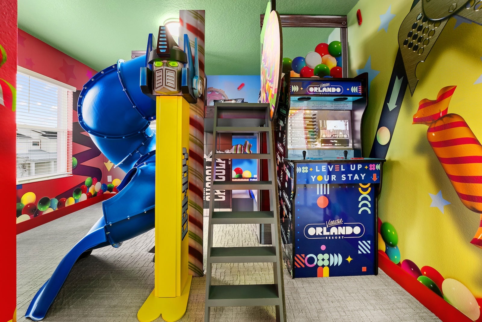 hotel room with slide and arcade game