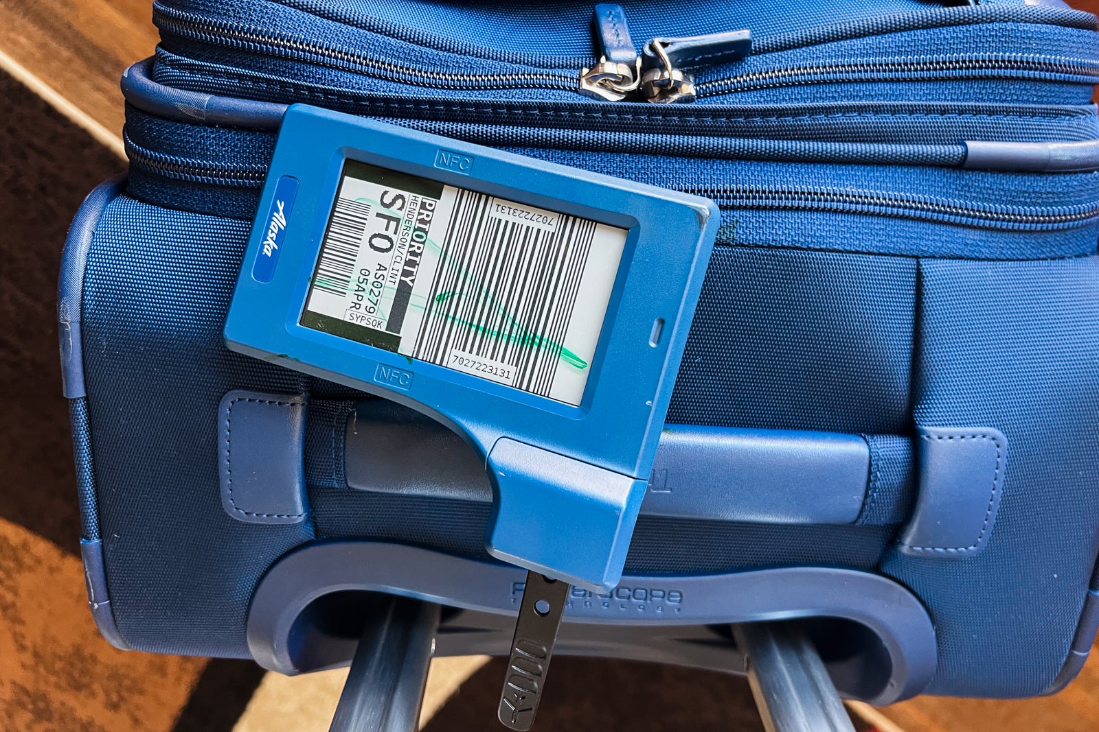 suitcase with digital bag tag