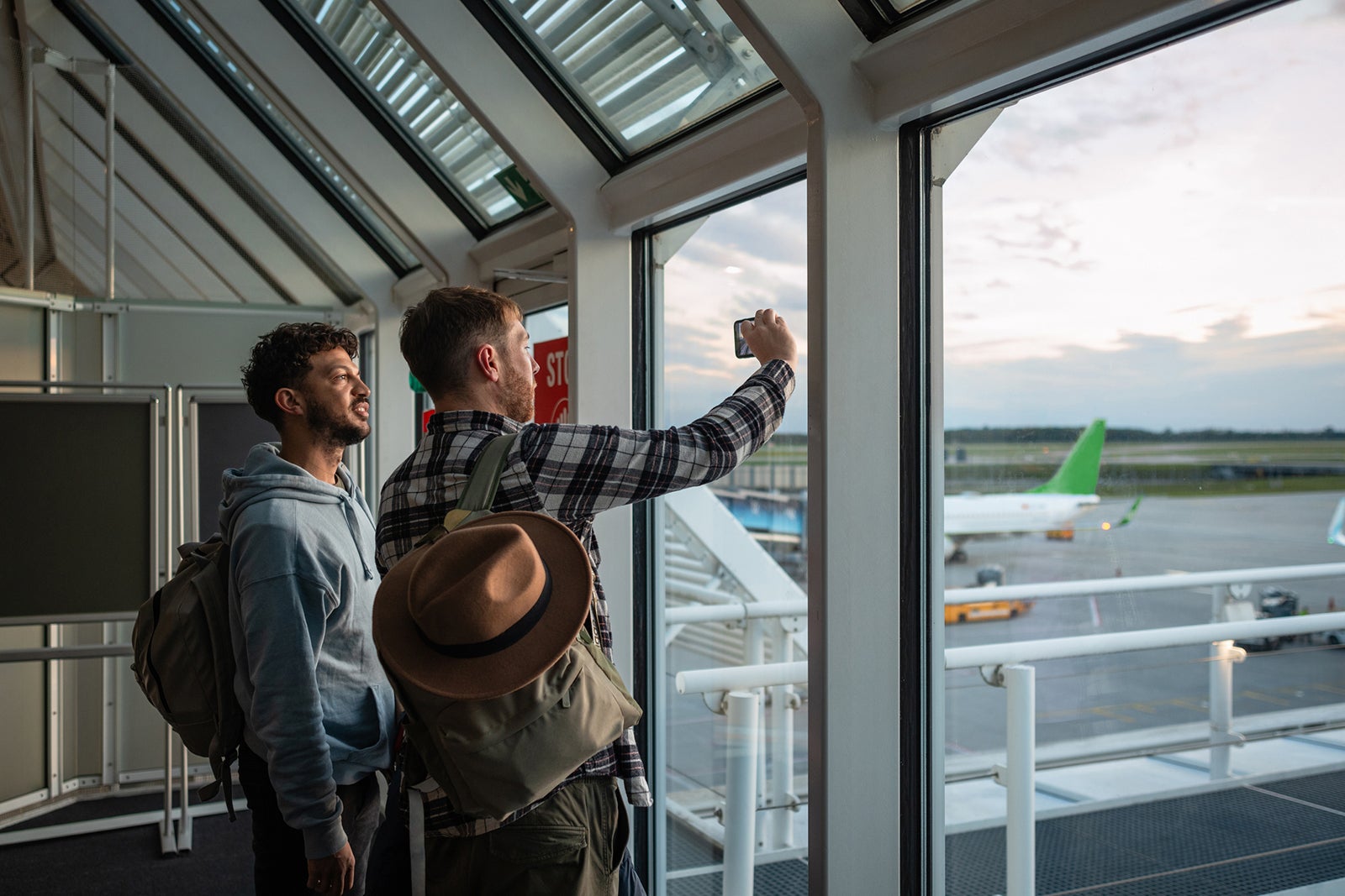couple at an airport together ready to go on holiday