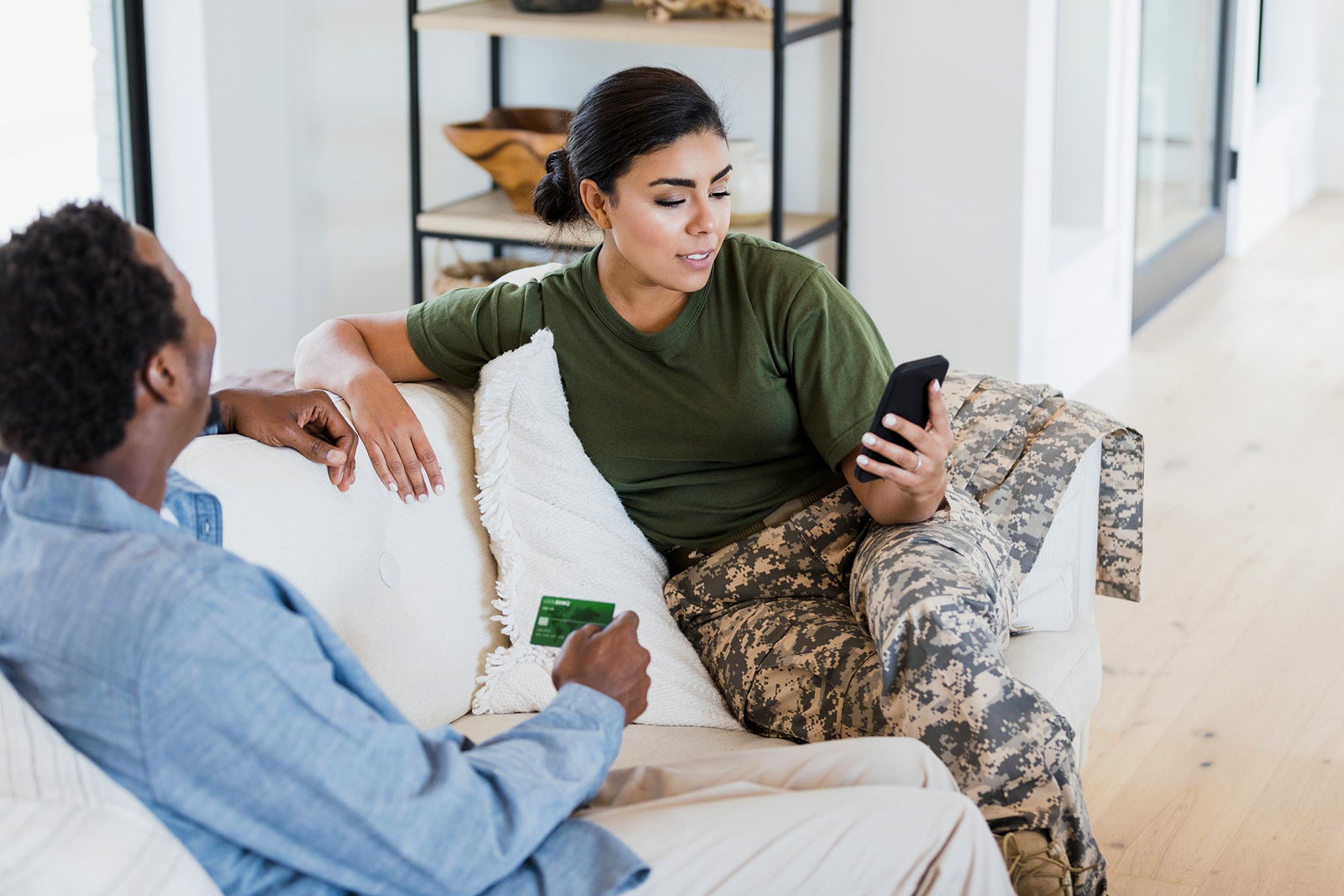 couple making online purchase with phone