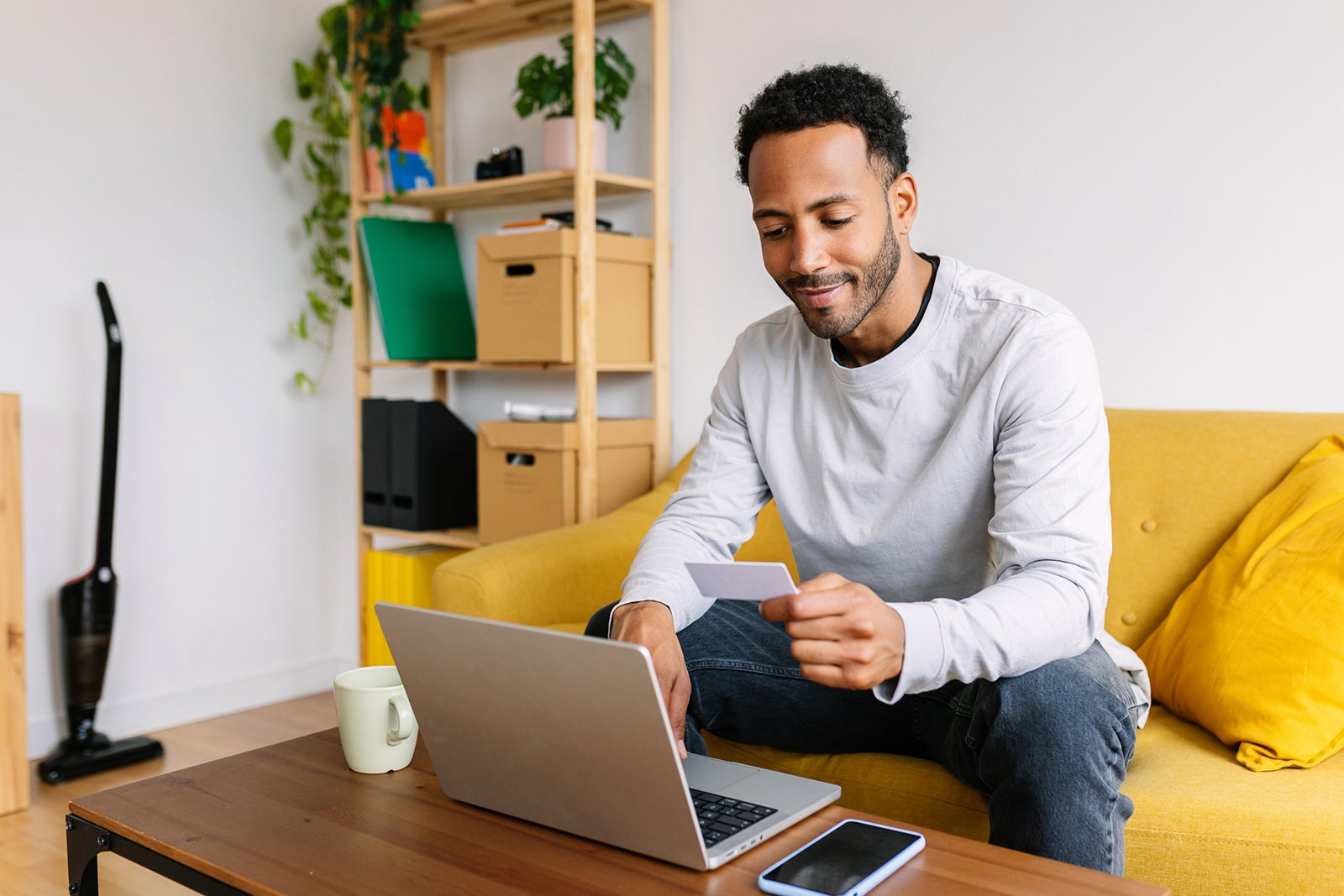 Man making an online purchase at home