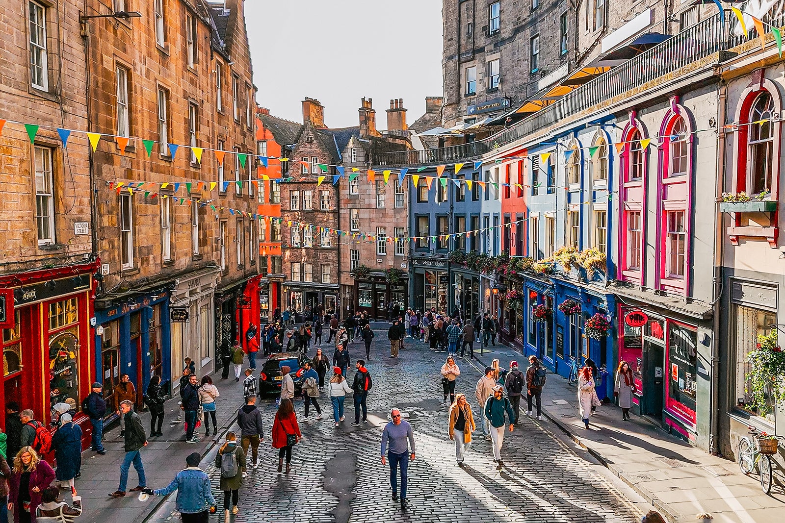 Aerial view of the famous colorful Victoria Street in the Old Town of Edinburgh, Scotland, England, Victoria Street in the United Kingdom, Victoria Street in the old town in Edinburgh Scotland England Crowds of tourists on the Royal Mile,harry potter city